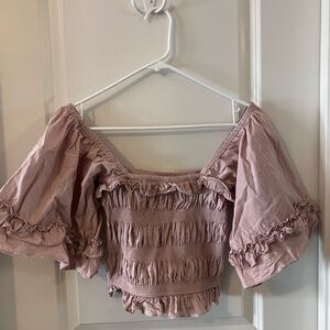 Kittenish blush ruffle top